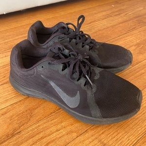 All black Nike shoes